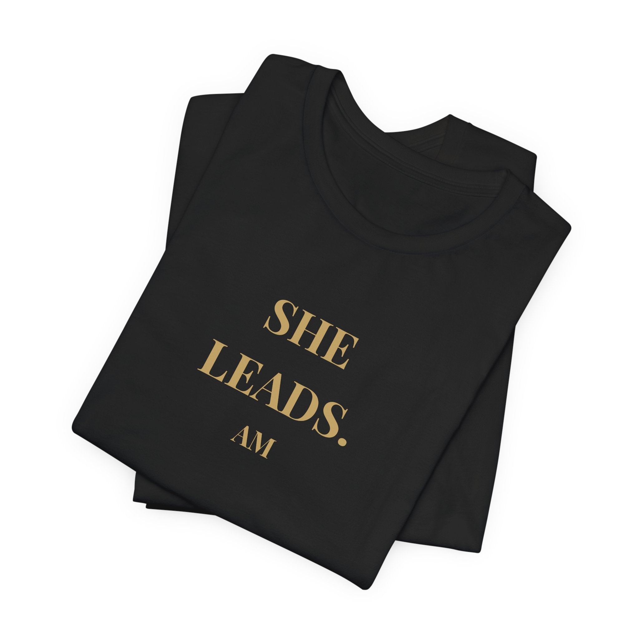 She Leads — Feminine Gold Script Leadership Tee